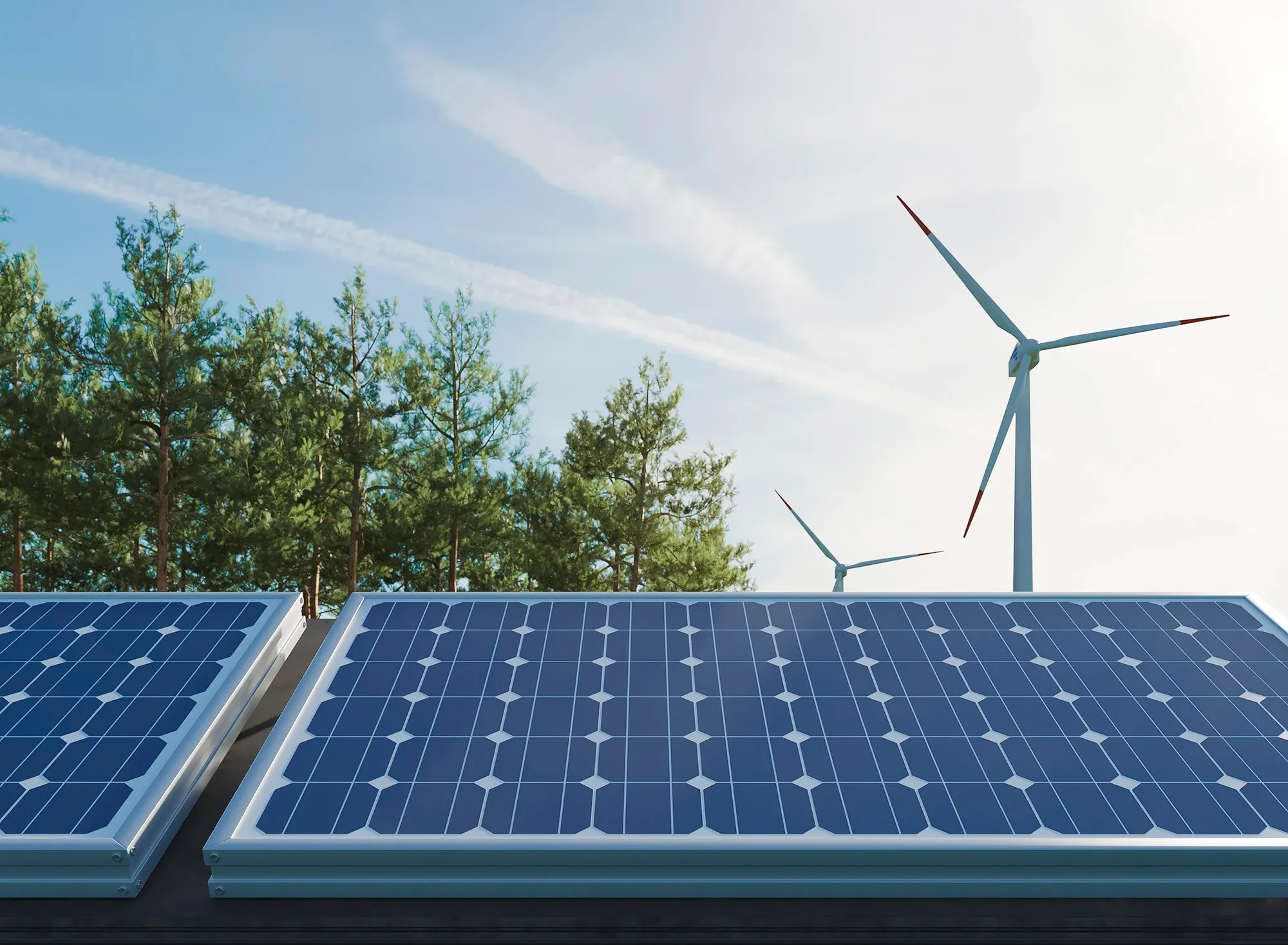 Solar panels with a wind turbine behind them